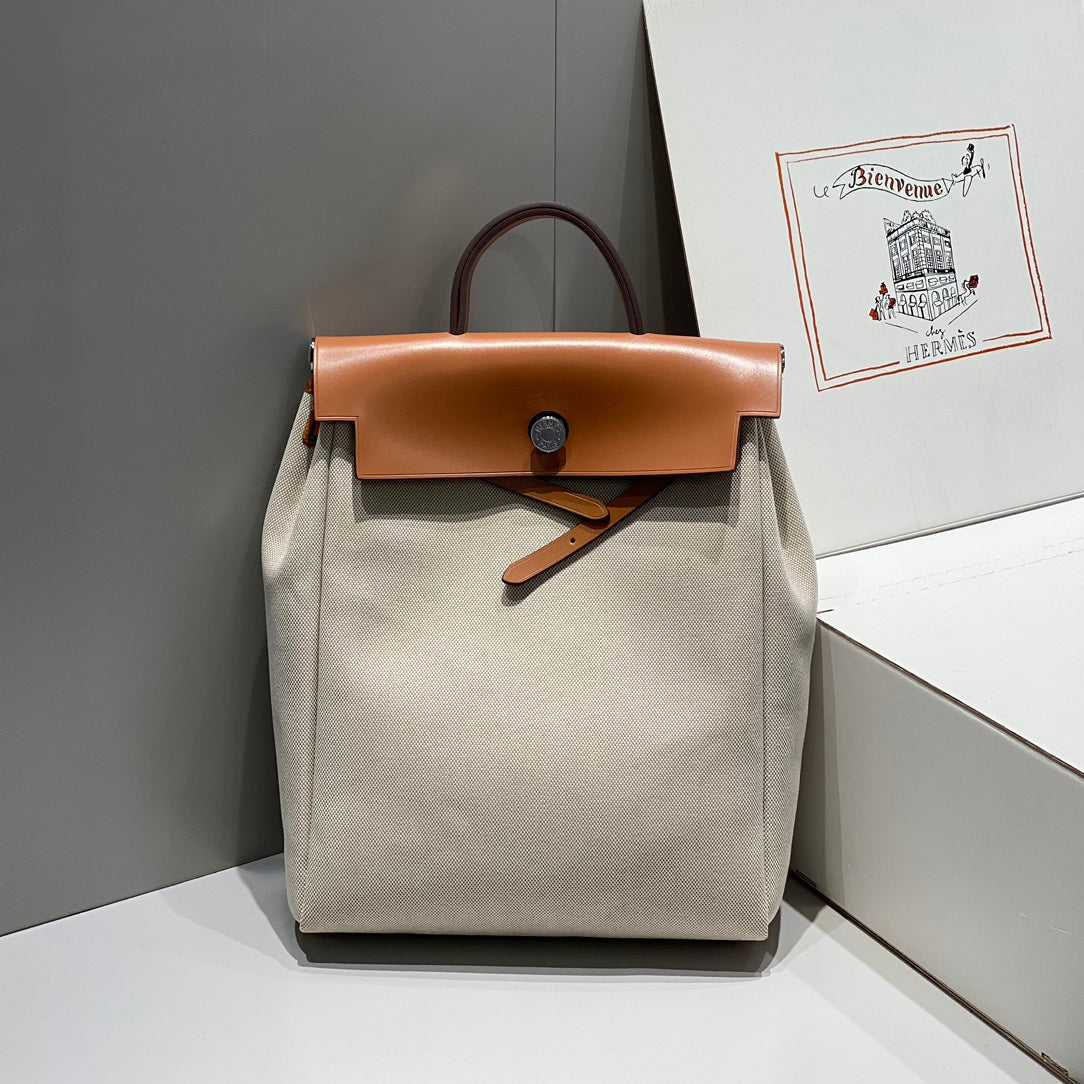 HERBAG A DOS ZIP RETOURNE BACKPACK 29 IN OFF-WHITE CANVAS AND BROWN CALFSKIN
