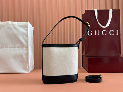 73 SMALL BUCKET BAG 20 IN NATURAL CANVAS AND BLACK CALFSKIN